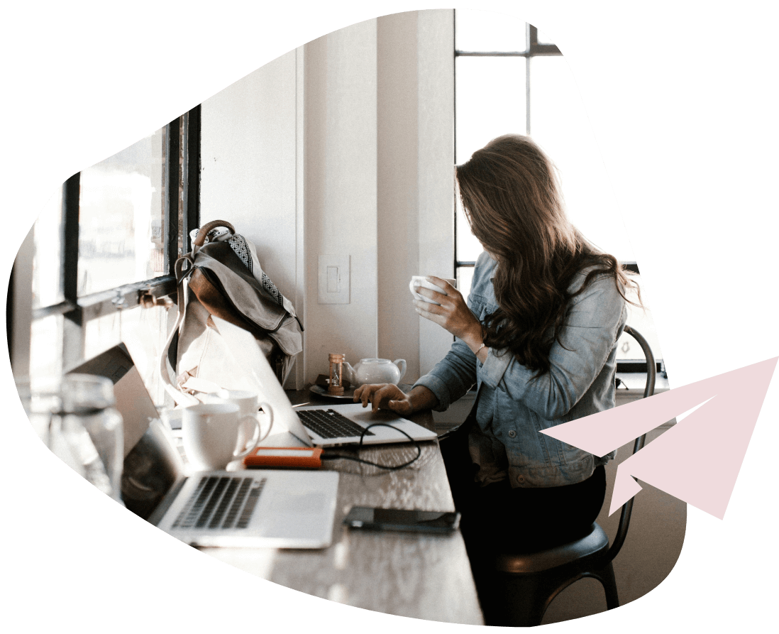 Woman reading compliance blogs online in a cafe